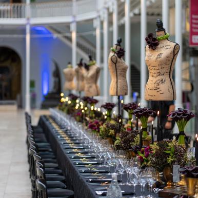Elegant dinner party table set up at National Museum of Scotland