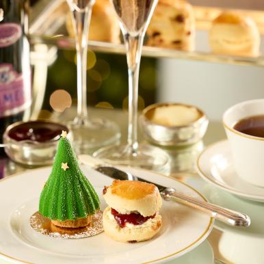 A scone and Christmas tree dessert at an afternoon tea