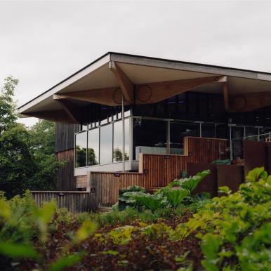 Exterior of the John Hope Gateway, with lush surrounding greenery.