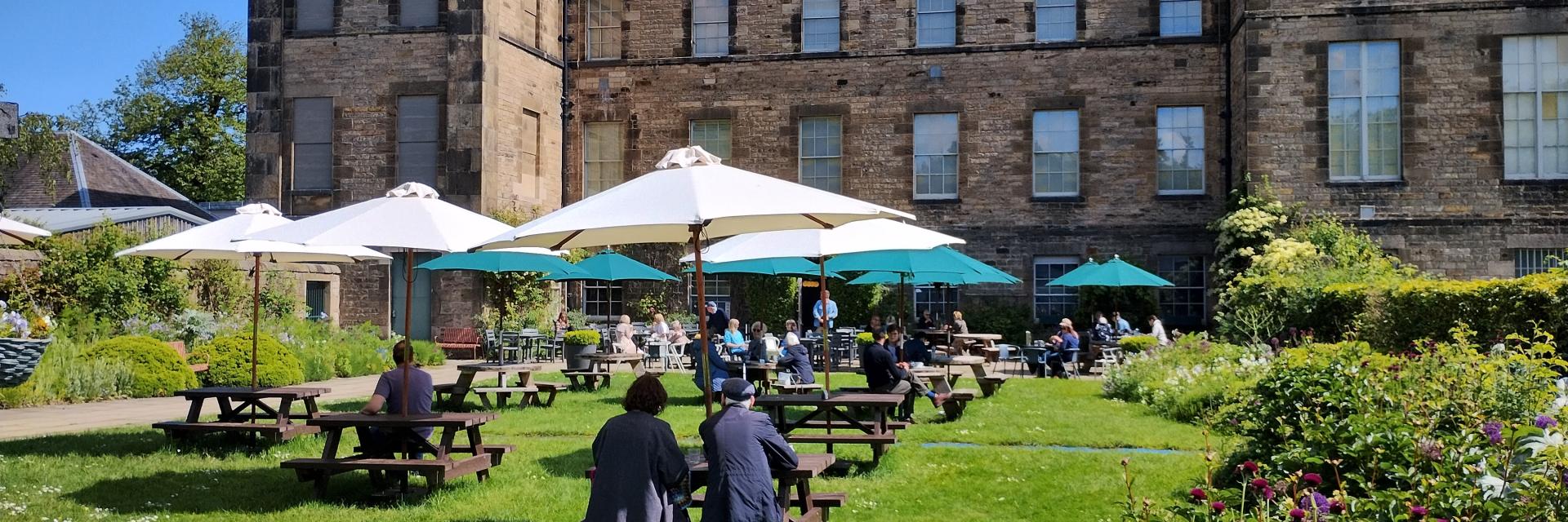 Outdoor dining in the garden at Cafe Modern One