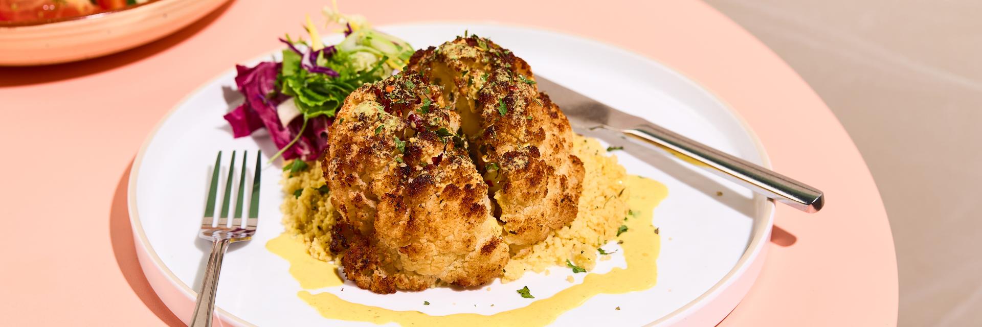 Harissa-Roasted Cauliflower and Couscous, Herbs, and Green Salad Leaves